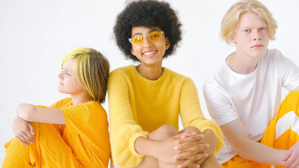 three teen models wearing yellow
